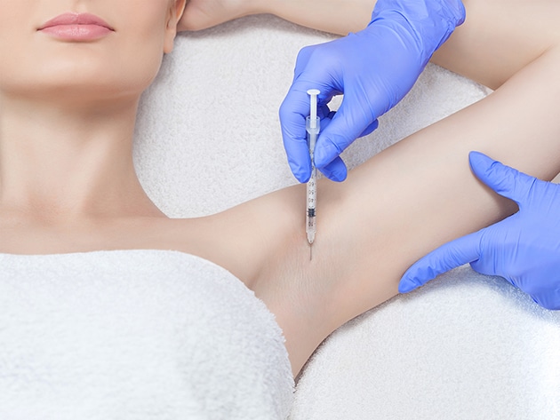Excess-Sweat Woman getting Botox injection in the arm pit to treat excessive sweating