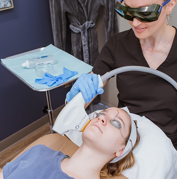 Acne-3 BBL Forever Young helps treat acne. Provider is treating a female patient with this light treatment.