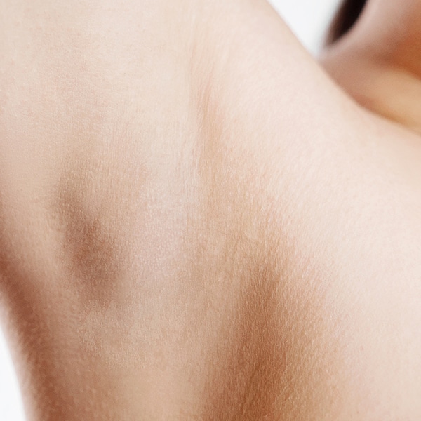 Woman's hairless arm pit