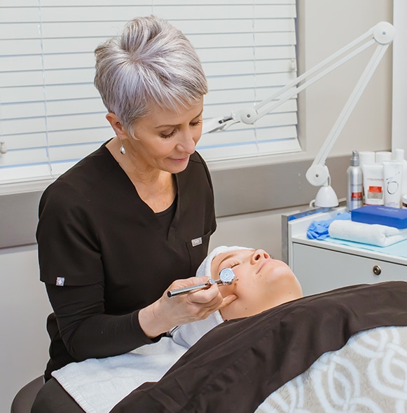 Provider giving patient a chemical peel.