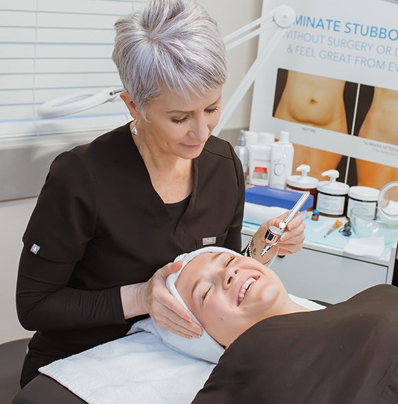 Shop-3 Patient and provider are laughing during an oxygen facial