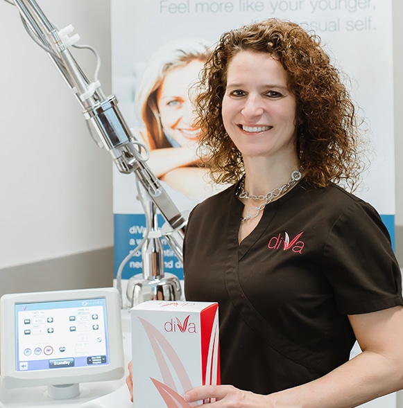 diVa 1 Dr. T holds diVa kit in front of the diVa laser by sciton